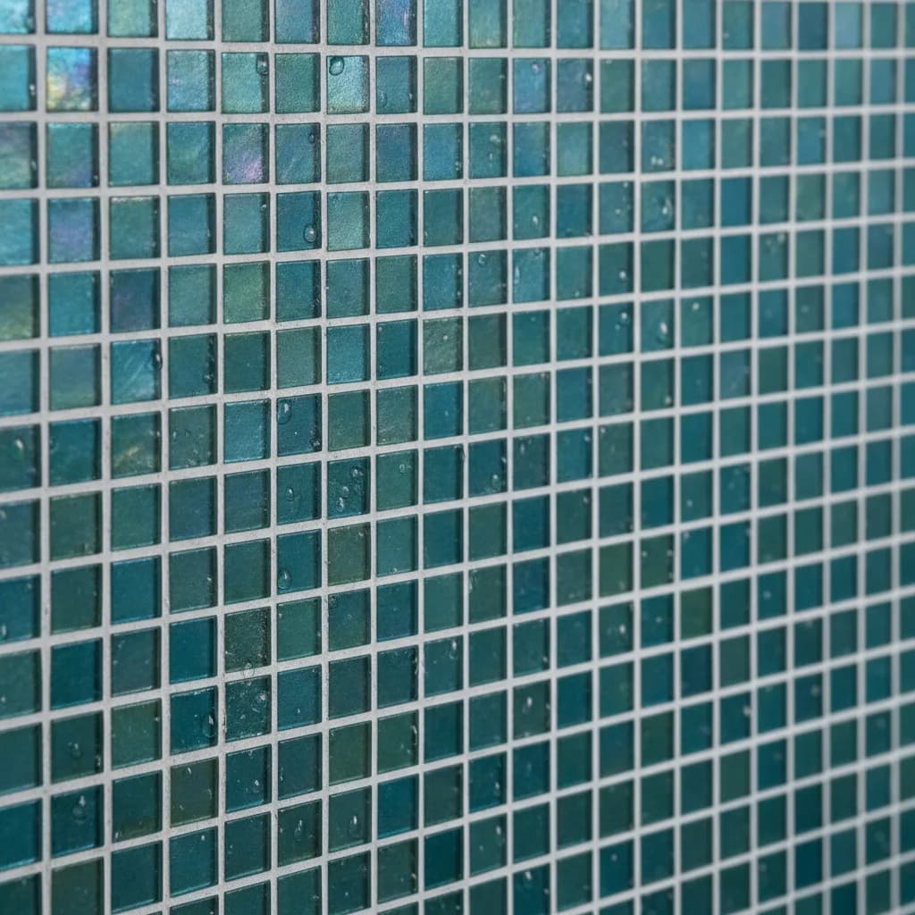 Iridescent teal and blue glass mosaic tiles installed by Banks and Co Ceramics, Sussex